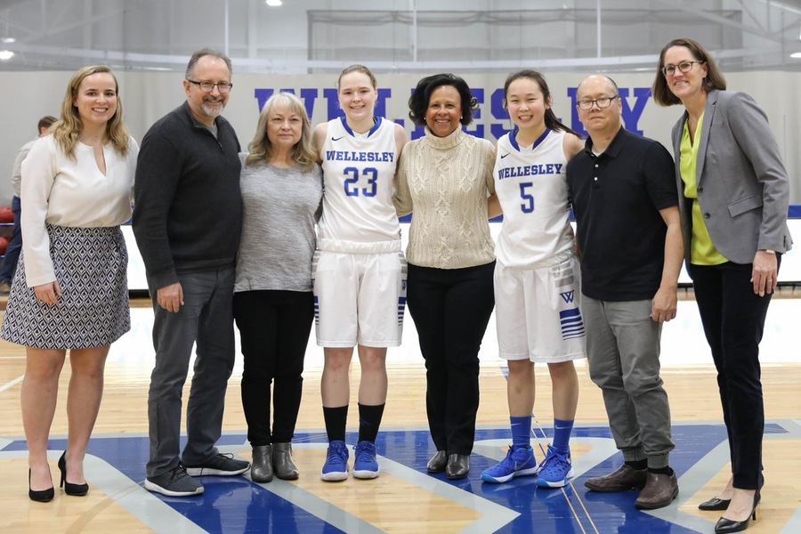 Wellesley seniors Chelsea Brown (left) and Kayla Jang (right) celebrated Senior Day with their families and Wellesley President Paula Johnson on Saturday (Miranda Yang).
