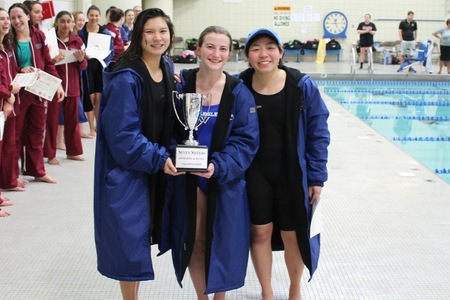 (L to R): Seniors Patricia Chen and Maura Sticco-Ivins, and junior Jessie Feng celebrate with Seven Sisters Trophy (MHC Athletic Communications).
