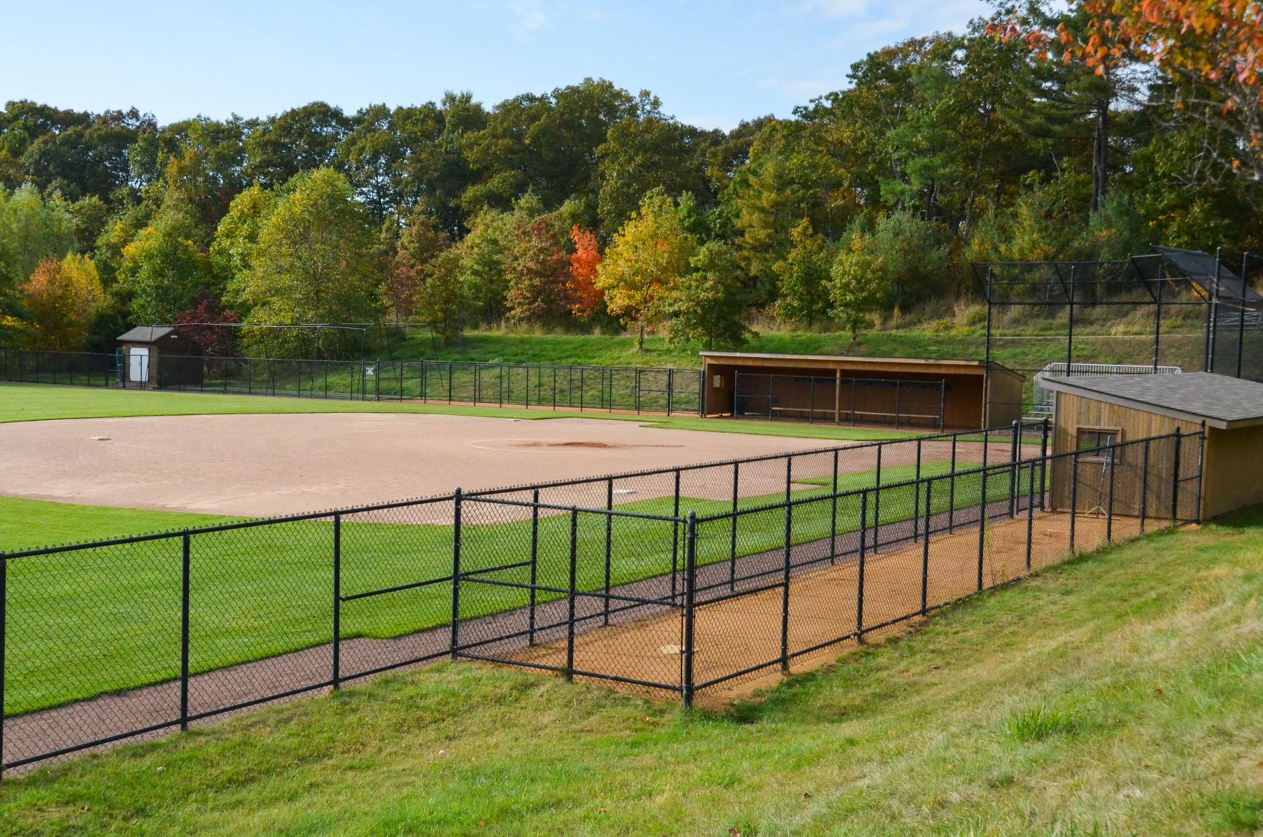 Softball field infield,  fencing and dugouts